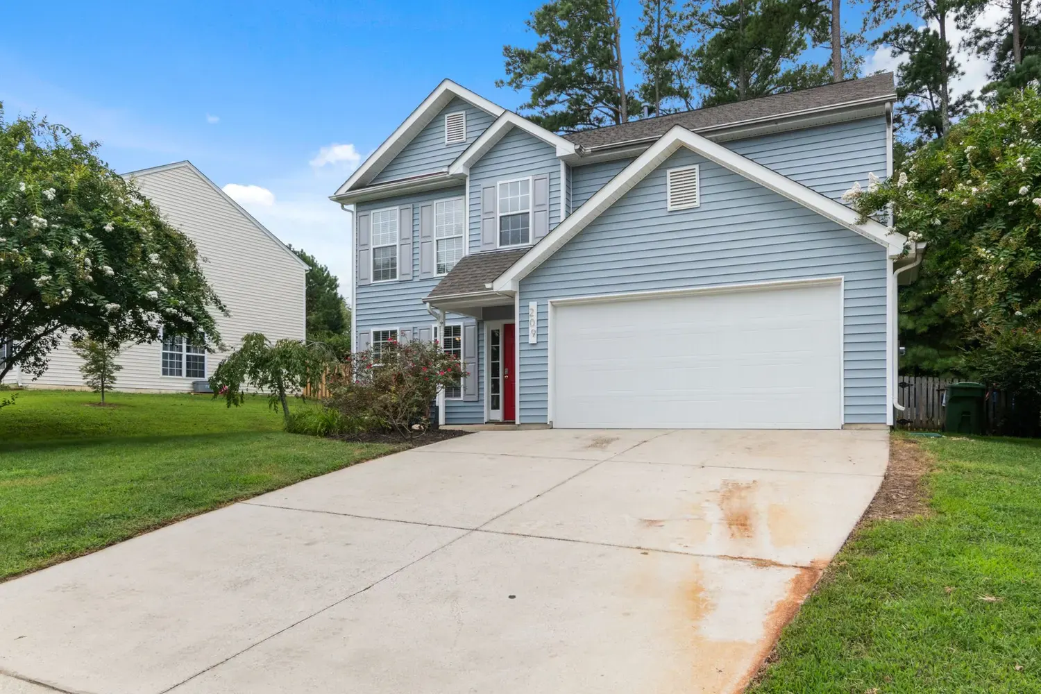Painting service area Marietta, GA: two-story home with siding and a driveway